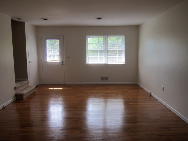 Empty interior of a newly completed or income-restricted apartment unit in the Portland metro area, illustrating persistent vacancies in affordable housing relevant to real estate appraisal and valuation.