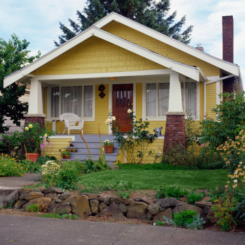 Yellow 20th-century bungalow in the Portland area typical of starter homes.