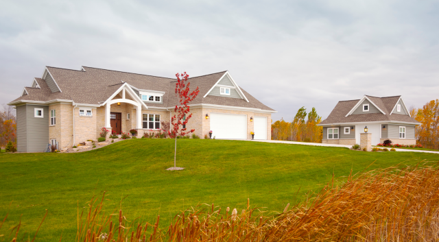 Suburban single-family home with detached guest house (ADU) in a Portland metro area neighborhood, eligible for expanded Fannie Mae financing under December 2025 guidelines.