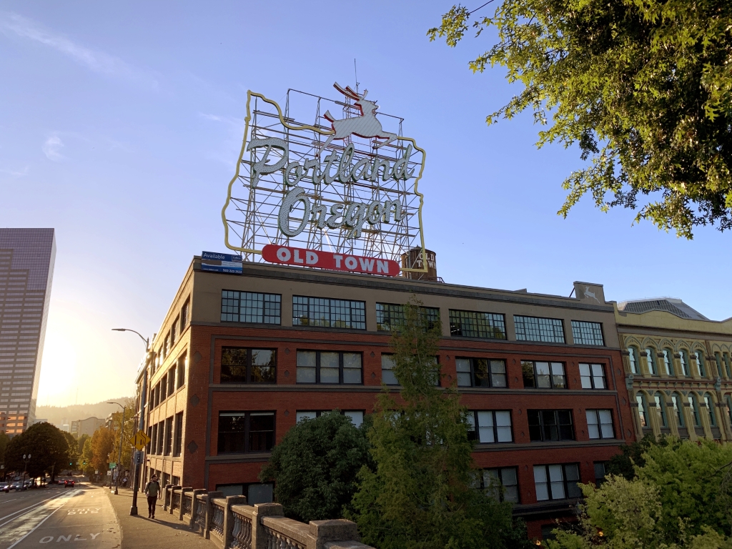 The Portland White Stag sign during the golden hour.