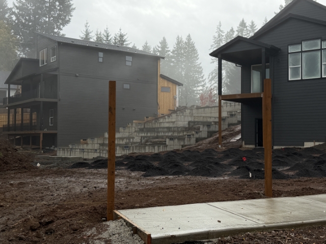 New single-family homes under construction in a vested subdivision in Sandy, Oregon. One home only has foundation poured.