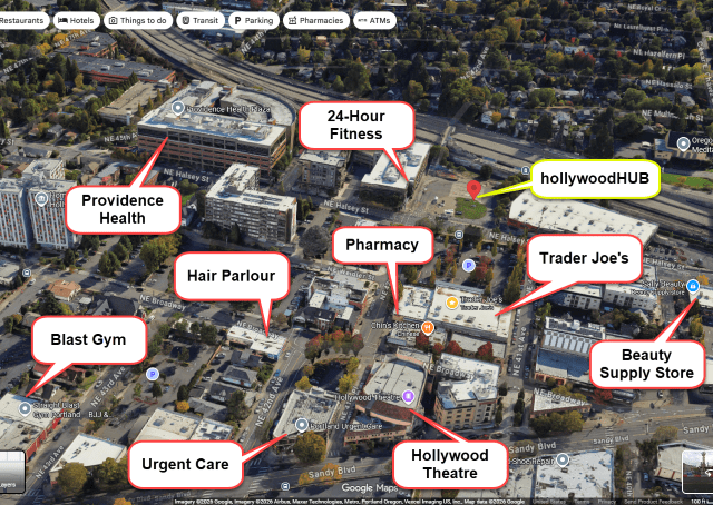 Labeled aerial map of hollywoodHUB affordable housing construction site at Hollywood Transit Center, Portland – showing proximity to Trader Joe’s, 24 Hour Fitness, MAX station, Providence Health, Hollywood Library, Hollywood Theatre, and Grant Park.